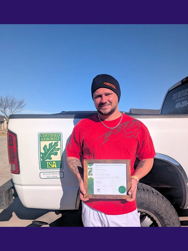 Dusty Medcalf with his professional diploma